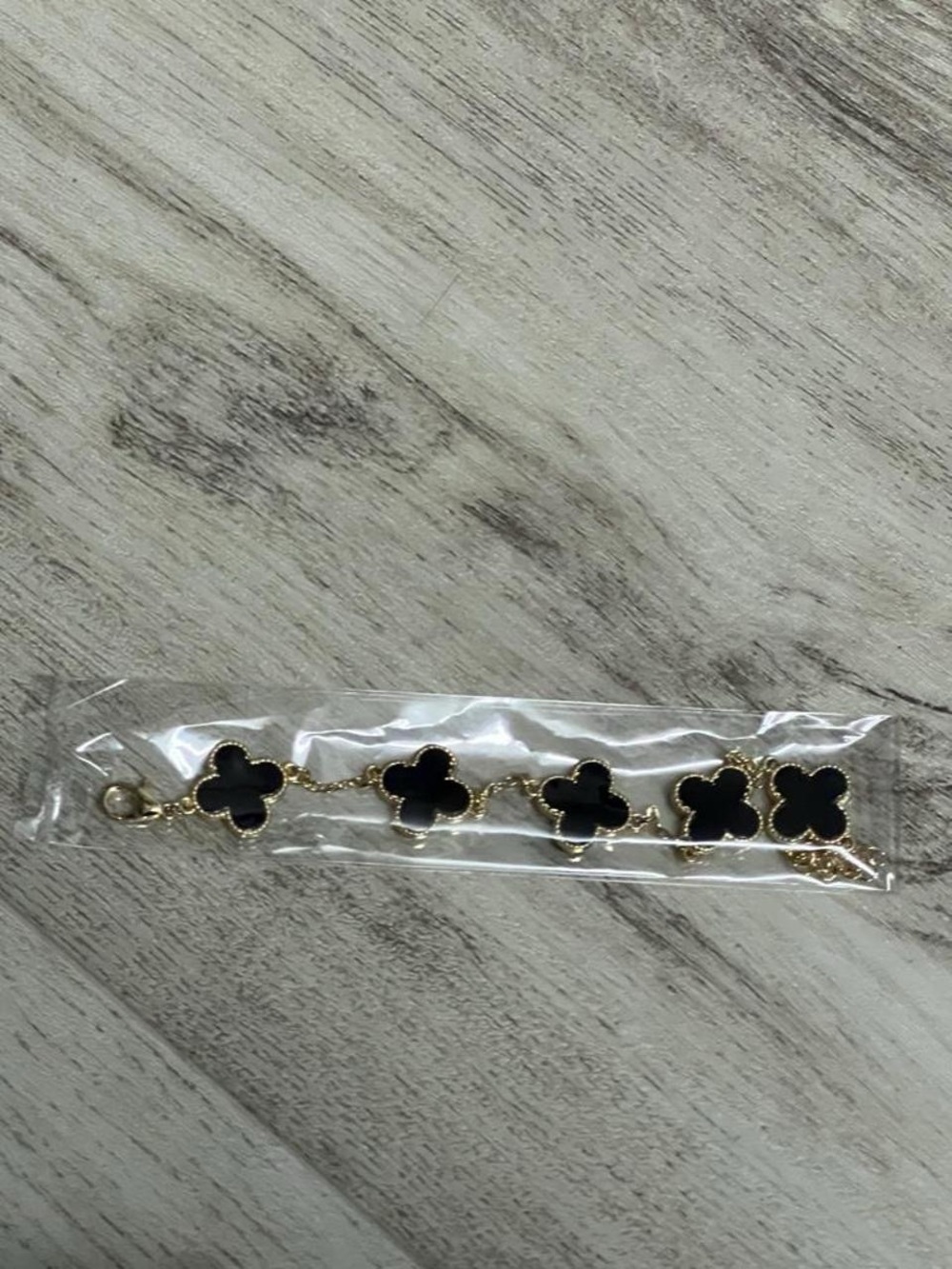 Gold-Tone Bracelet with Black Clover Accents